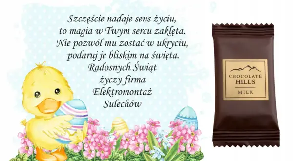 Uroczy kurczaczek z pisankami i kwiatami, obok czekoladka "Chocolate Hills". Wesołych Świąt życzy firma Elektromontaż Sulechów.