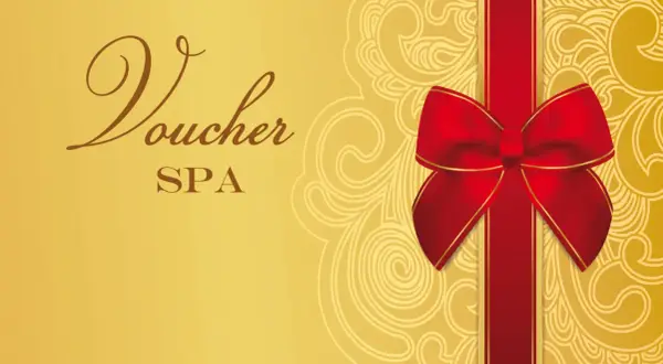 Złoty voucher do spa z ozdobną czerwoną wstążką i kokardą. Idealny prezent na relaks.