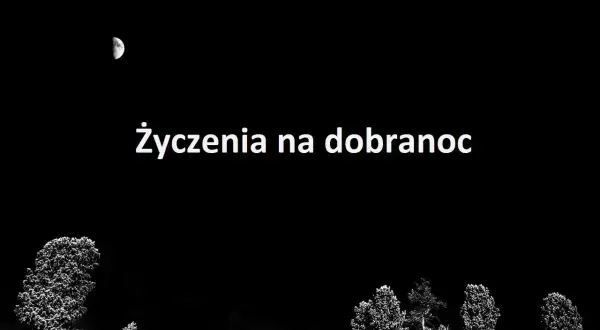 Księżyc na nocnym niebie nad polami i drzewami. Napis "Życzenia na dobranoc" zaprasza do spokojnego snu.
